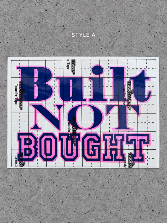 Style A Built Not Bought vinyl decal with Royal Pink outline and Glossy Blue lettering on transfer tape